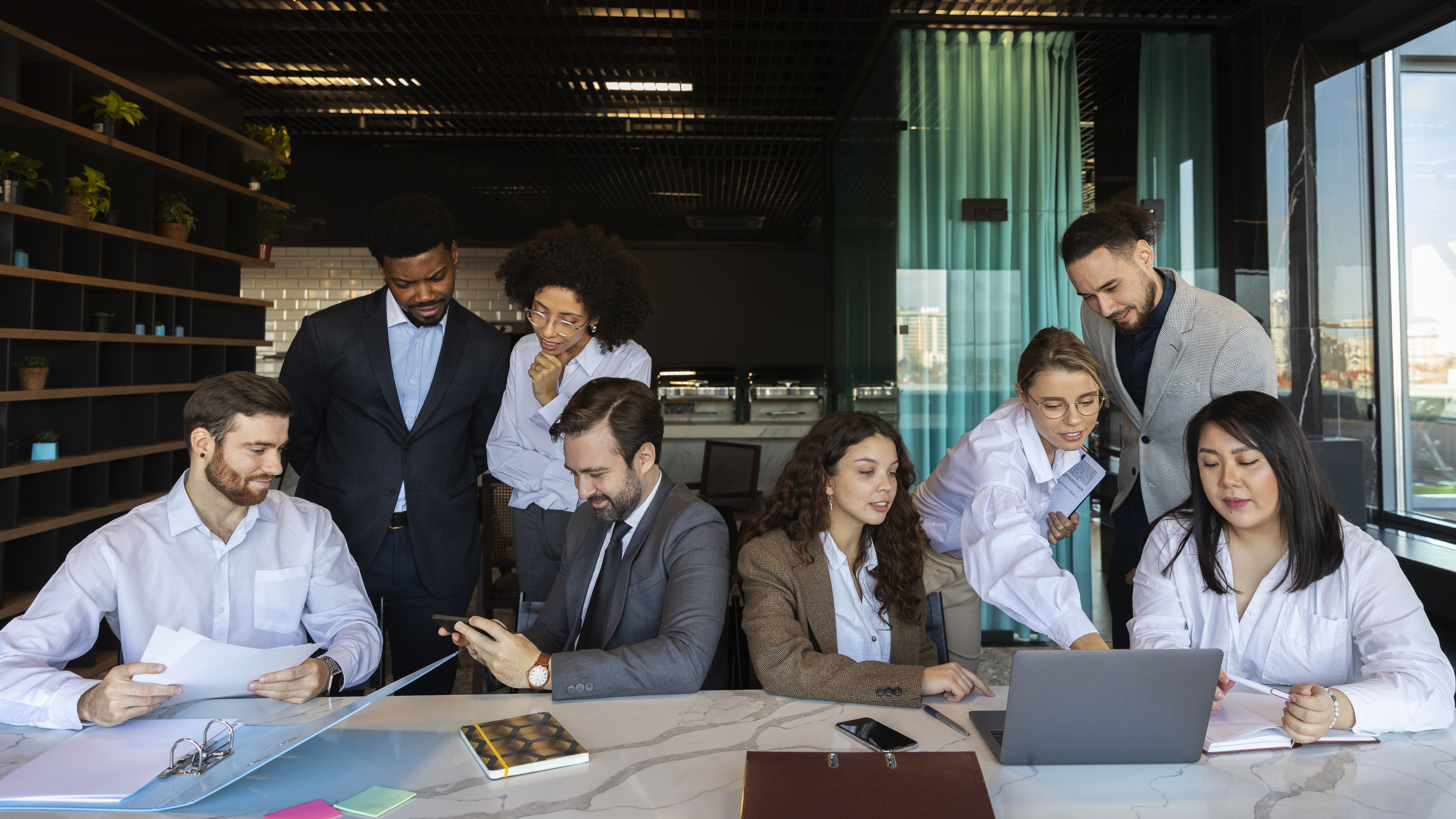 Group of professionals discussing in a bright meeting room